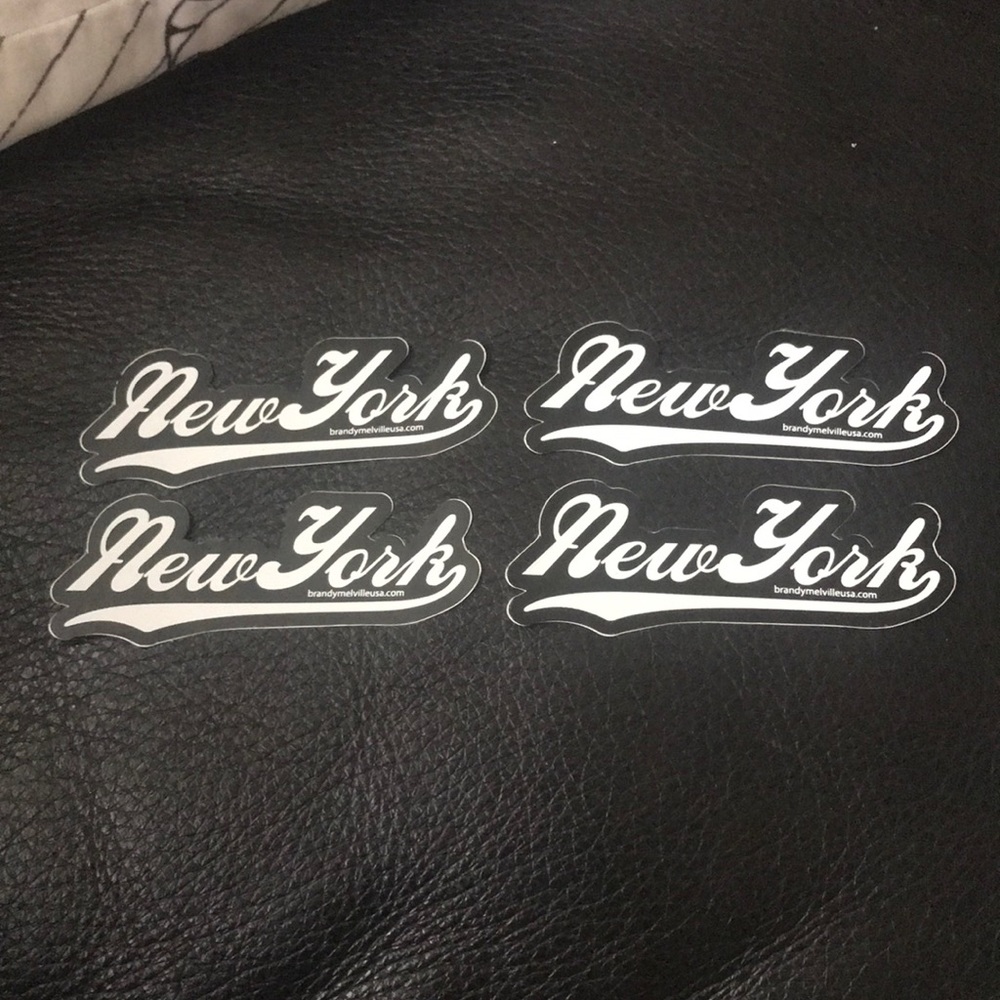 four black “new york” stickers